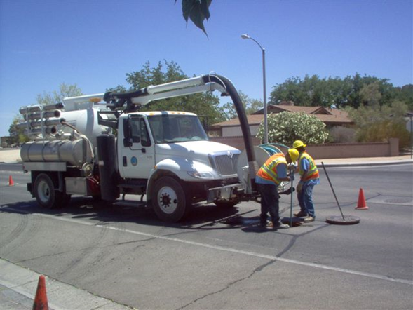 Vactor Truck Crew Maintaining Wastewater Lines